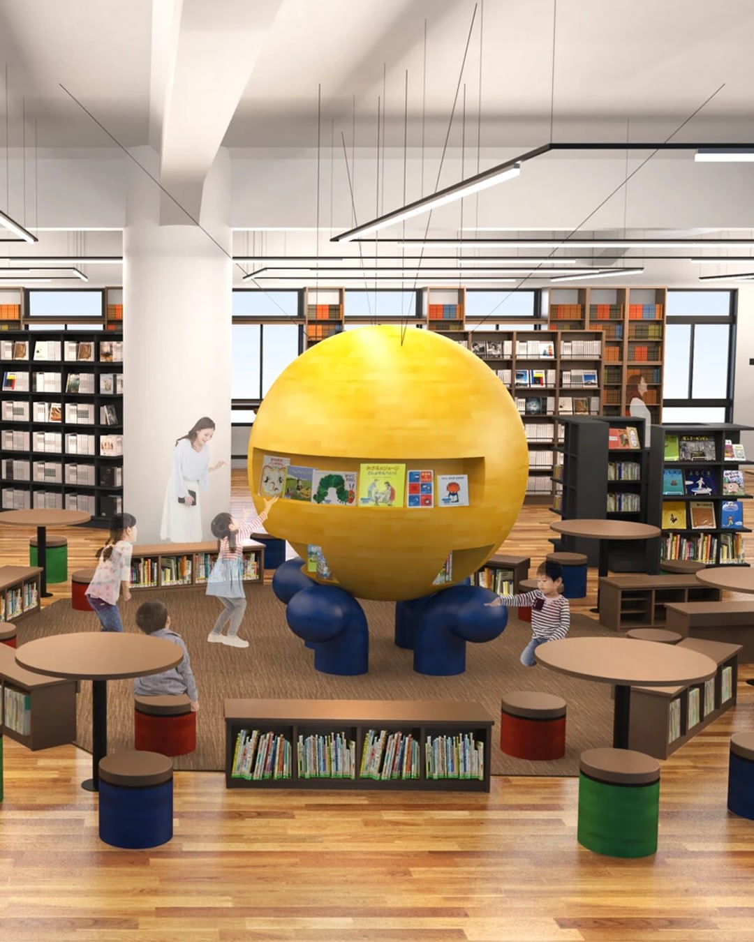 三宮図書館の館内で絵本に手を伸ばす子どもたち